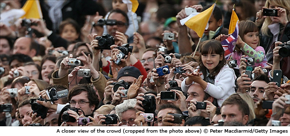 A close up view of the crowd as Pope Benedict XVI travels along the Mall in his popemobile to attend a prayer vigil in Hyde Park, 18 September 2010