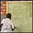 Child writing on greenboard