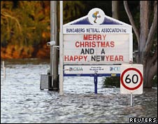 Partly-submerged signs in Bundaberg, Queensland