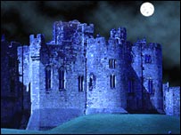 Spooky castle in moonlight