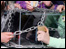 hands pulling chains off a box