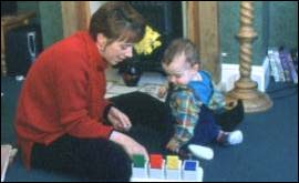 A child and carer playing 