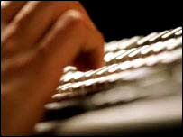 Fingers on a computer keyboard