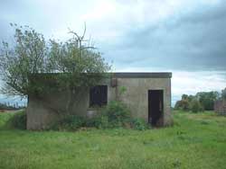 Squat Stocky Building with barred windows.