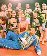 Henri The Clown poses with the dancers.