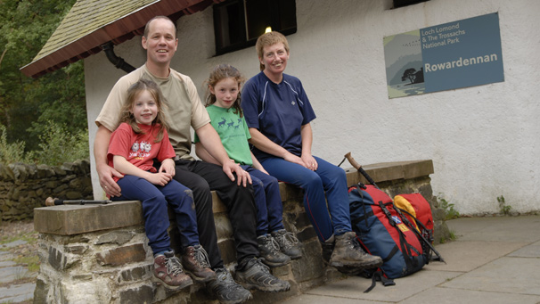 Happy family at bottom of mountain
