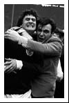 A Scottish fan hugs Jim Baxter after the match
