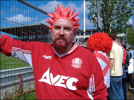 Jersey supporter sports a red wig