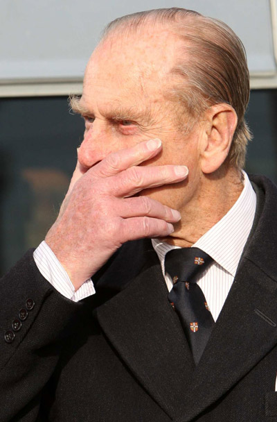 Prince Philip with a hand over his mouth