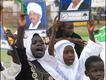 Children holding posters of President al-Bashir