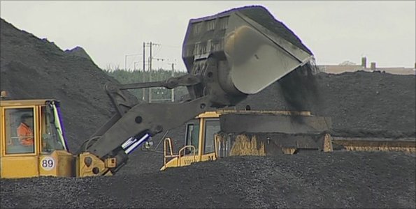 A digger moves coal.