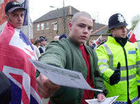 National Front member handing out leaflets