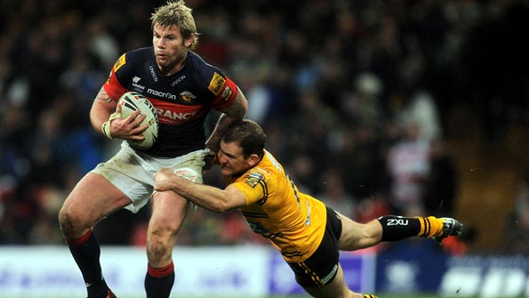 Danny Orr tackles Wakefield's Glenn Morrison