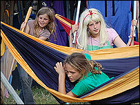Children playing in hammocks