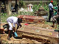 Aid workers bodies being exhumed (photo RG Dharmadasa)