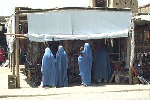 Many women still wear the traditional burkha