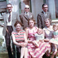 A family snap (Left to right) great uncle Jim Fitz-Simon, great grandfather Matthew Morrow, grandfather Norman Morrow, (front row), grandmother Jeanie Morrow, mother Carol McAuley great aunt Olive McQuoid. Brother Simon and Linda and sitting on knees