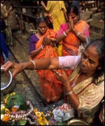 Hindu women making offerings at The Ganges