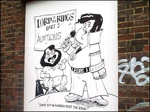 giant cartoon of Peter Jackson and Elvis