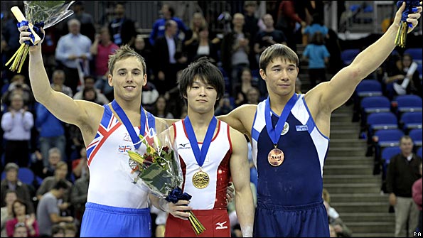 Daniel Keatings celebrates his silver with the other medallists