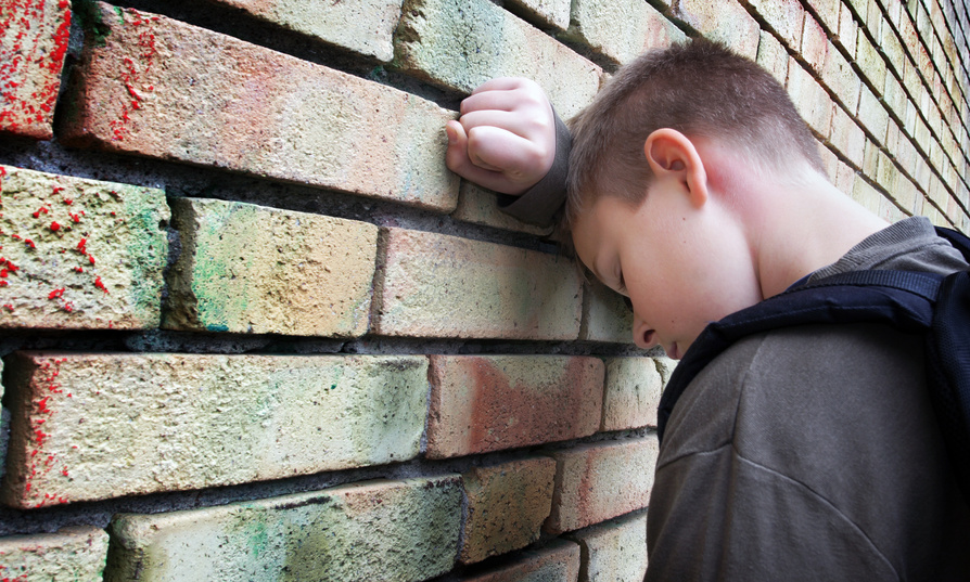upset boy against a wall@ Mikael Damkier - Fotolia
