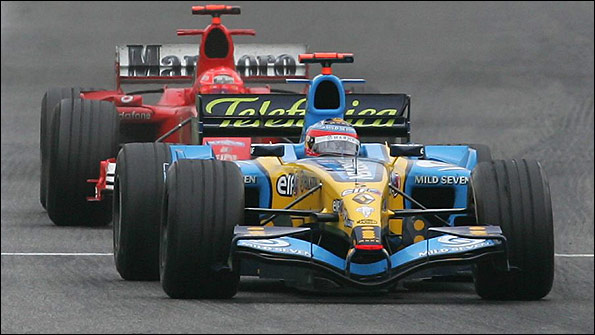 Renault's Fernando Alonso holds off Michael Schumacher's Ferrari in the closing laps to win the 2005 San Marino Grand Prix
