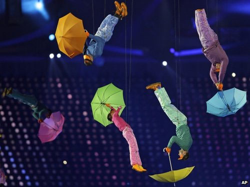 Performers with umbrellas are suspended in the air during the opening ceremony for the Paralympics 2012