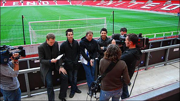Dan prepares to interview Wayne and Kelly on the side of the Old Trafford pitch