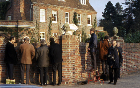 Photographers by wall