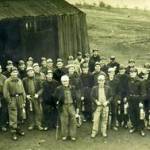 The Bevin Training camp era at Birley East Colliery and a group of trainees and instructurs pose for the camara near the lamp cabin at the eastern end of the pit yard.