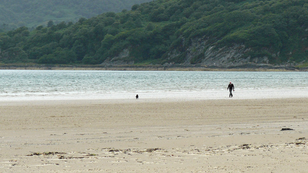 Man with dog on Carradale Bay