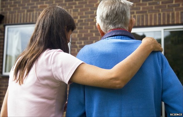 Woman helping an older man