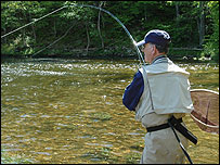Martin James hooking a trout