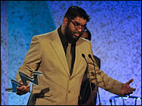 Mohammed Ali receives the award. Pic:ITV
