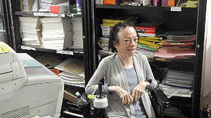 Liz Carr looking very pleased with her stationery cupboard finds.