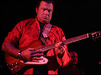 Steven Seagal on his beloved guitar.