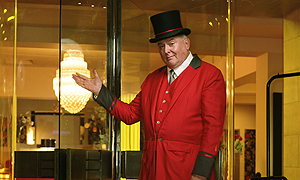 Michael Attwell as Derek the doorman