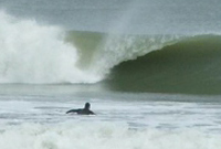 unknown paddling out by Rob Bridge