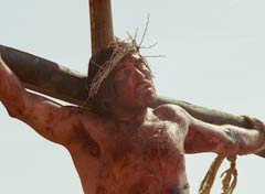 Jesus hanging from his cross, dead or dying