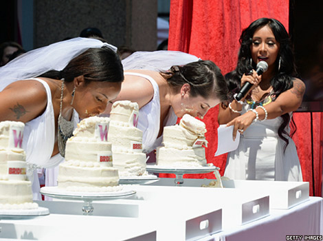Brides in a cake eating competition