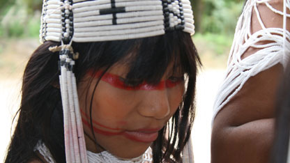A Marubo woman wearing traditional headdress