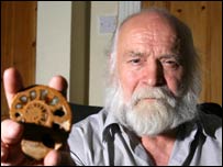 Trevor Morris holding an ammonite