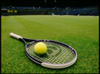 Tennis racquet and ball