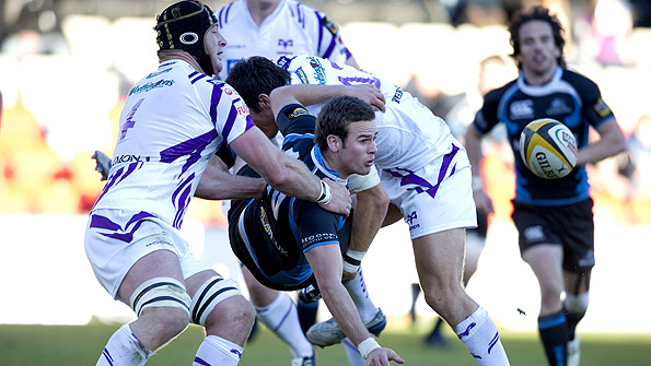 The tackles are harder and in the pro game, as Glasgow Warriors' Ruaridh Jackson discovers. Photo: SNS.