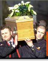 Image of men carrying coffin of sectarian murder victim