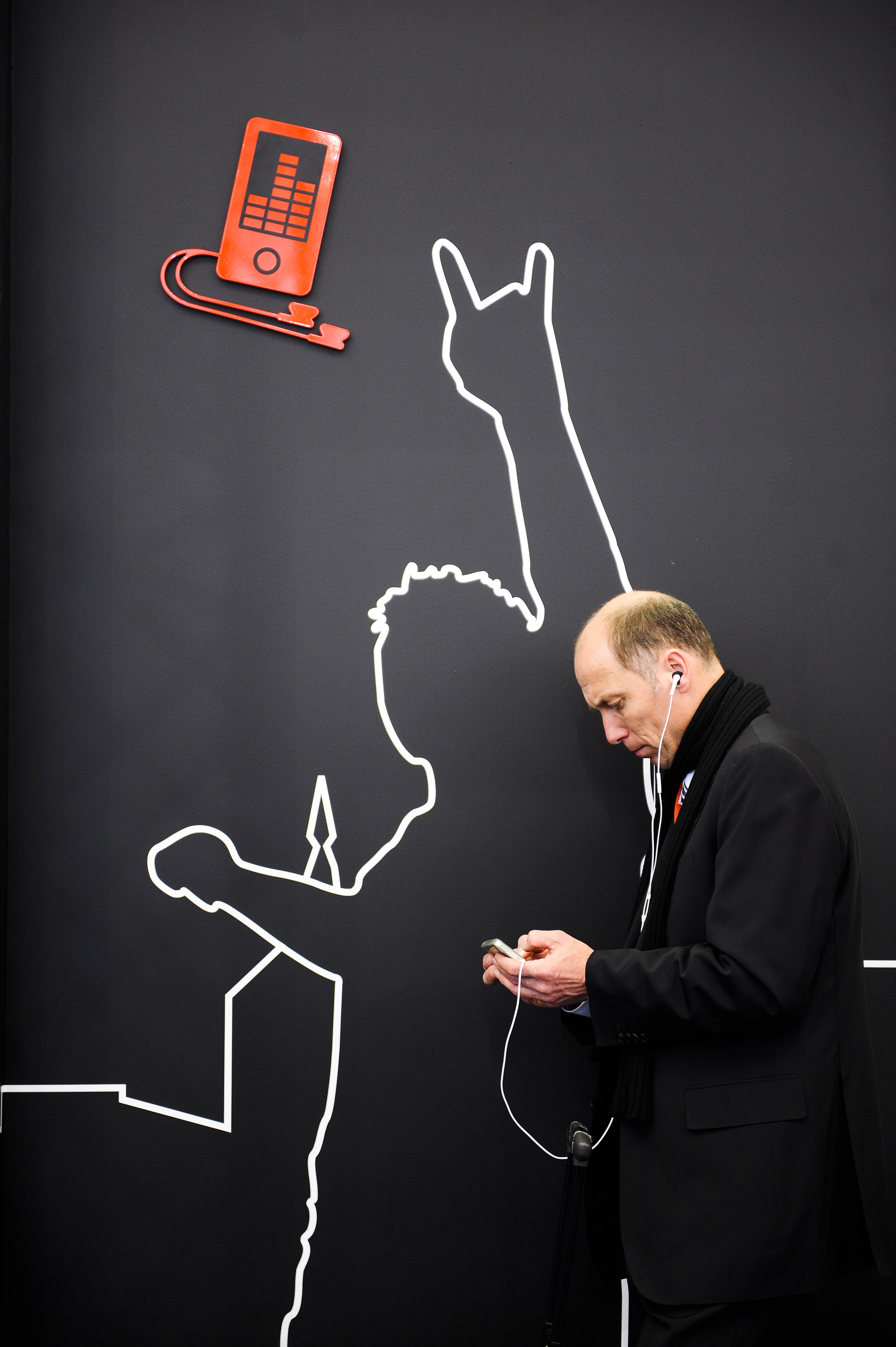A visitor checks his mobile phone as he attends the 1st day of Mobile World Congress on February 14, 2011 in Barcelona, Spain. The Mobile World Congress hosts some of the world