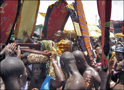 The Ashanti queen mother is carried by her followers to celebrate a decade of rule by her son Otumfuo Osei Tutu II.