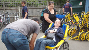 Liz in the oversized baby seat