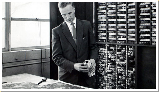 Photograph of Robert Biggin Creative colourist in Templeton's carpet factory 1963, looking at wool samples