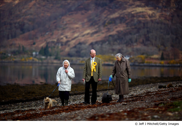 Alan Reid, the Liberal Democrat candidate for Argyll and Bute, meets constituents as he walks beside Loch Etive